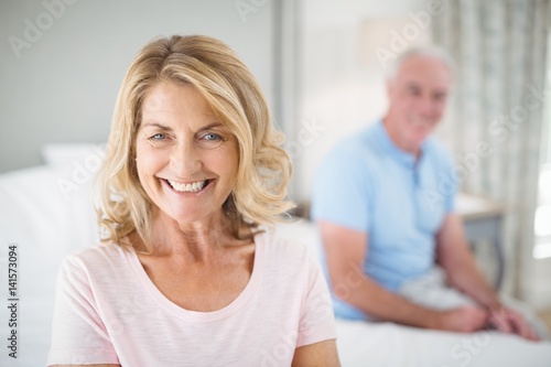Portrait of senior woman smiling in bedroom