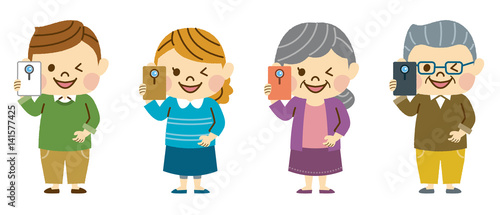 スマホで写真を撮る家族