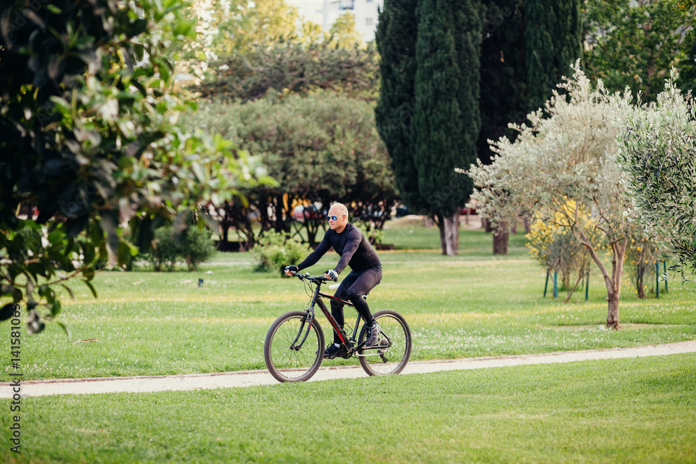 Man Cycling in Park