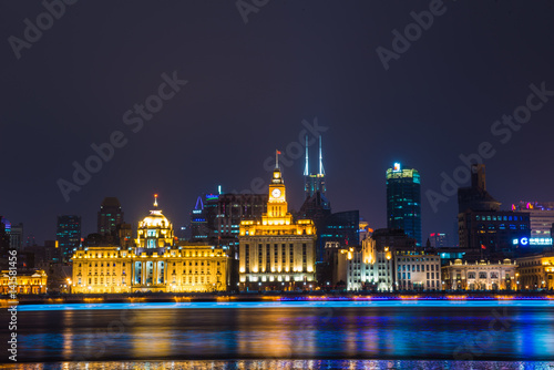 Night view of River Boats on the Huangpu River and as Background the Skyline of the Northern Part of Puxi 
