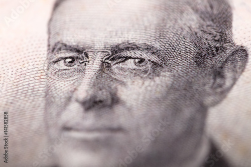 Woodrow Wilson eyes close up on money photo