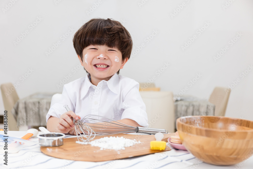 Asian Chinese little boy prepare for baking cookies Asian Chinese little boy prepare for baking cookies