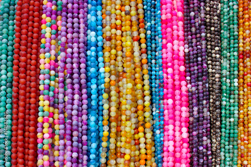 Background pattern of multicolored natural stone beads