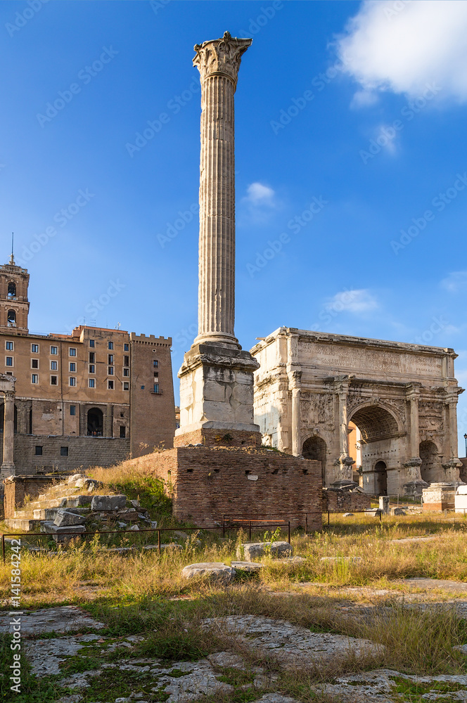 Rome, Italy. The Roman forum, from left to right: the column of Phocas (608) and the arch of Septimius Severus (205 AD)