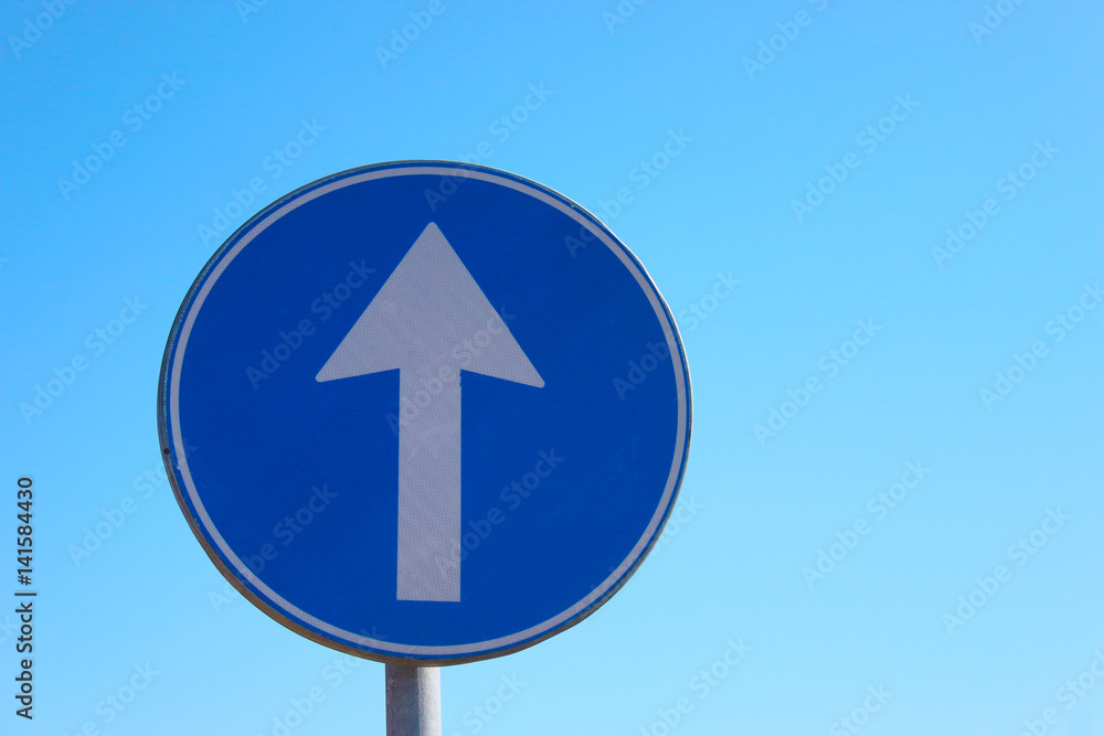 Arrow road sign direct way on a sky background