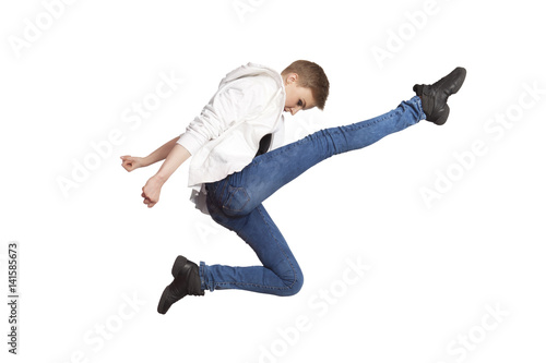 Young casual woman jumping. Isolated