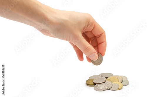 hand of young girl holding coins.