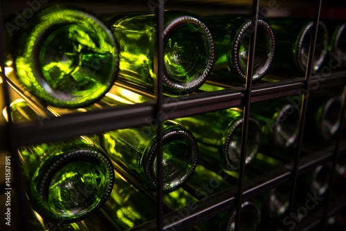 stack of wine bottles in winery