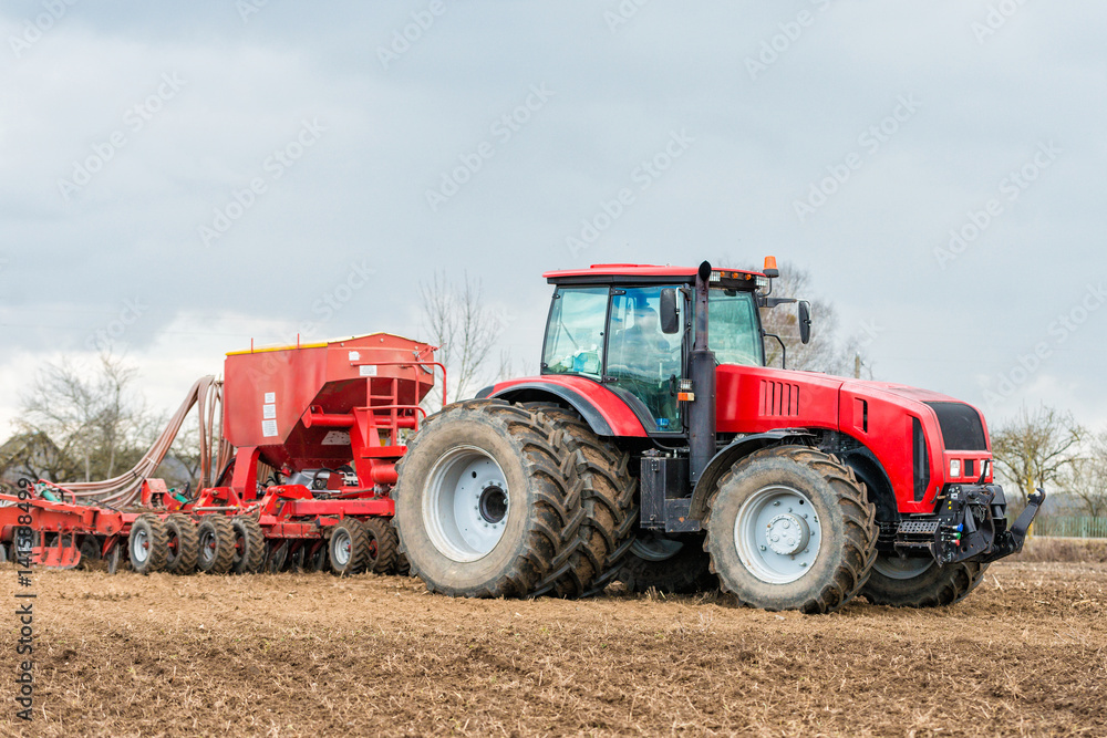 Farmer tractor working in the field. Spring time for sowing. Planting crops. Farmer tractor working in the field. Spring time for sowing. Planting crops.