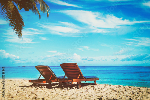 Two chairs on tropical beach