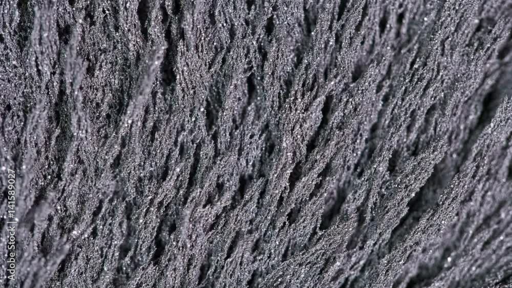 Magnetic chips form patterns in a magnetic field