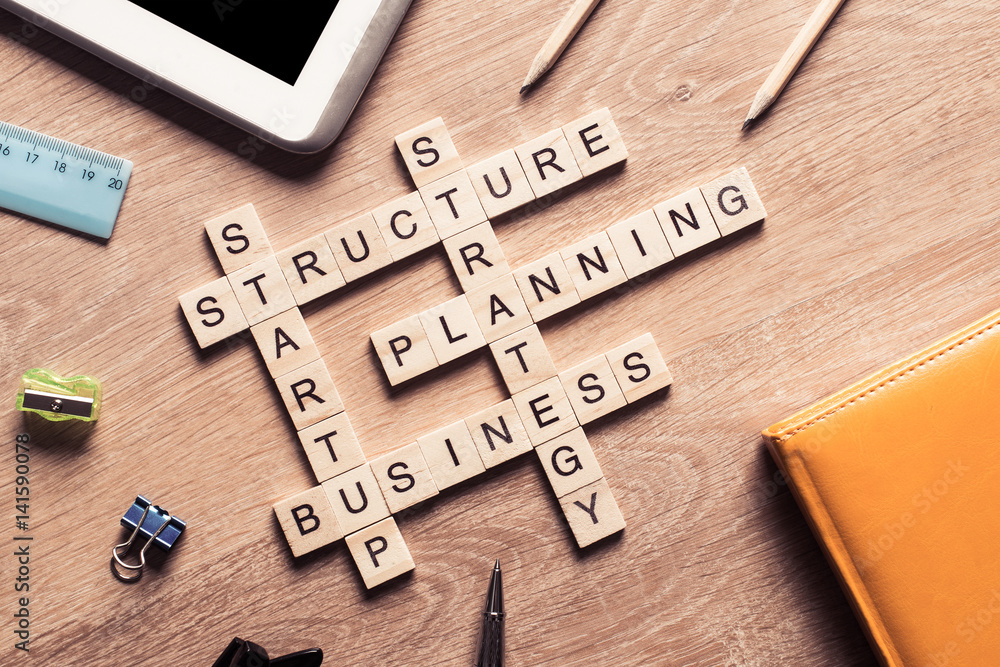 Conceptual business keywords on table with elements of game maki Conceptual business keywords on table with elements of game maki