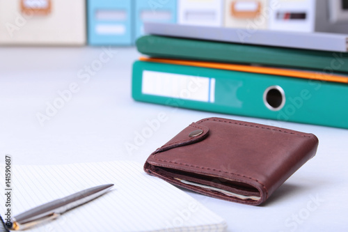 Wallpaper Mural leather wallet with credit cards, Folder file, and note on the desk. blurred background. Torontodigital.ca
