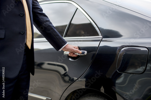 Businessman Handle Limousine Door Car