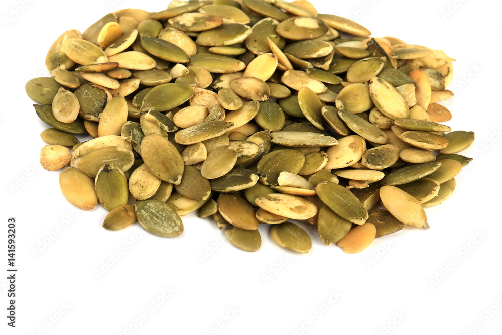 Peeled pumpkin seeds isolated on white background Peeled pumpkin seeds isolated on white background
