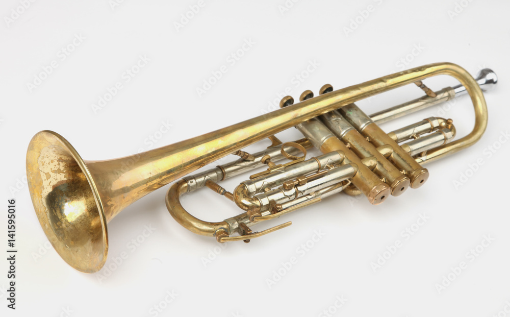 Obraz premium old trumpet on white background