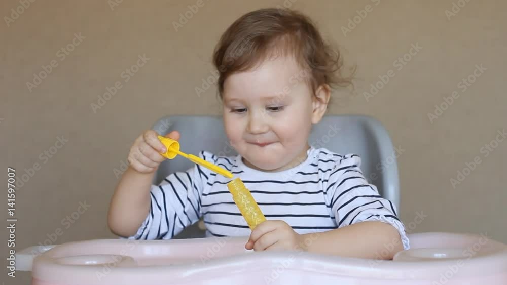 funny little baby playing bubbles