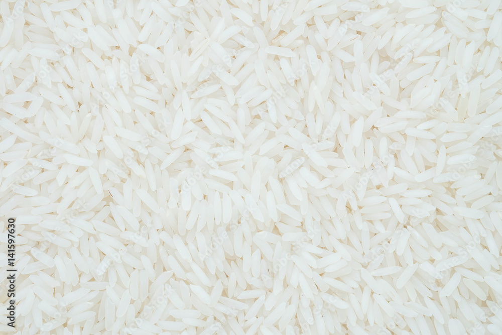 Closeup pile of white rice called jasmine rice textured background Closeup pile of white rice called jasmine rice textured background