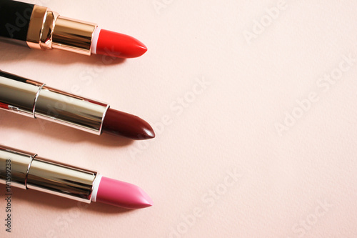 Lipsticks on a beige background