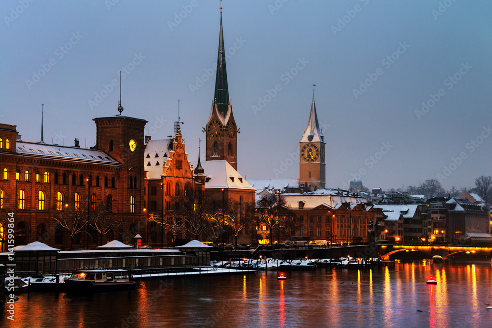 Fototapeta premium Zurich, Switzerland. Illuminated St. Peter Church and old Clock tower