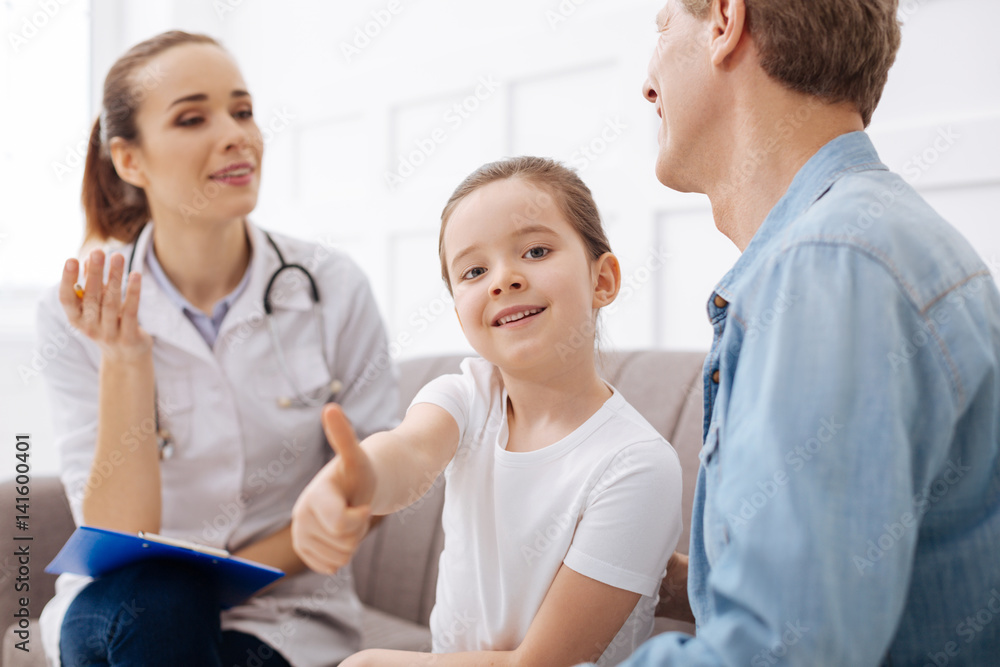 Doctor and childs father having a pleasant conversation Doctor and childs father having a pleasant conversation