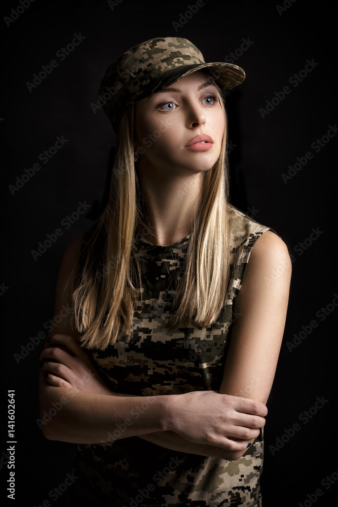 portrait of beautiful woman soldiers in military attire on black background portrait of beautiful woman soldiers in military attire on black background