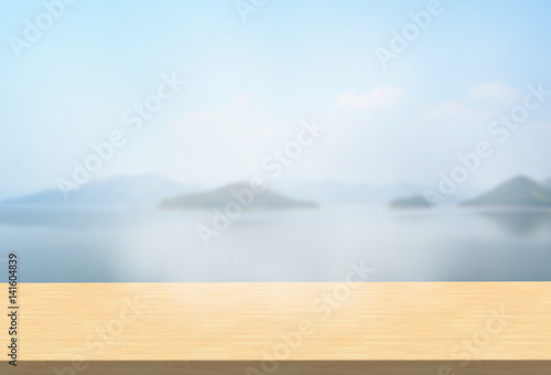Laminate table top on blurred mountains landscape background can put or montage your products © krung99