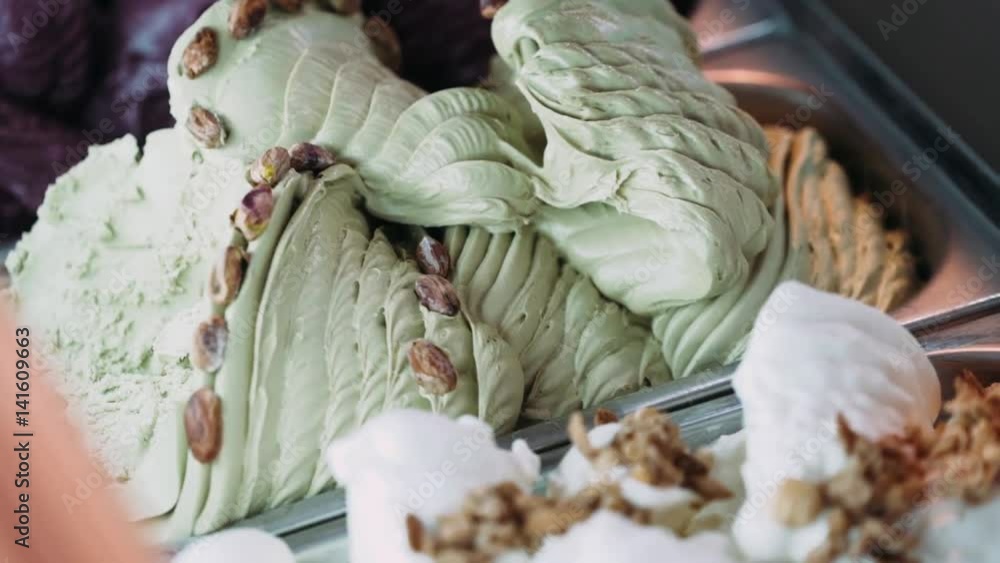 Different types of ice cream in the fridge. Dessert. Icecream shop