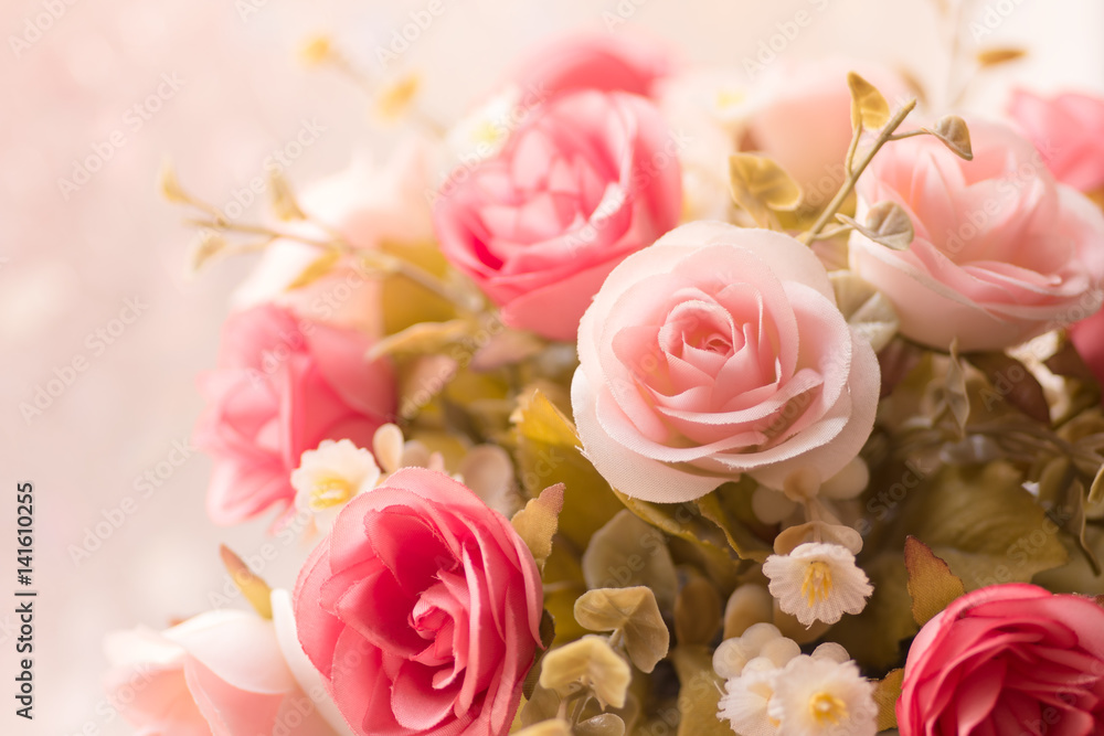 Beautiful Decoration artificial rose flower in pink tone background.