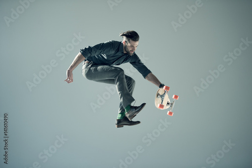 man holding skateboard