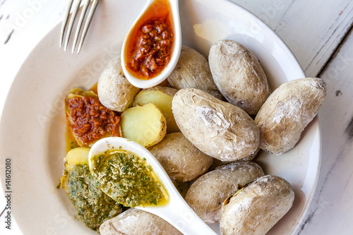 Canarian potatoes ,papas arrugadas with mojo, hot sauce. Spanish food