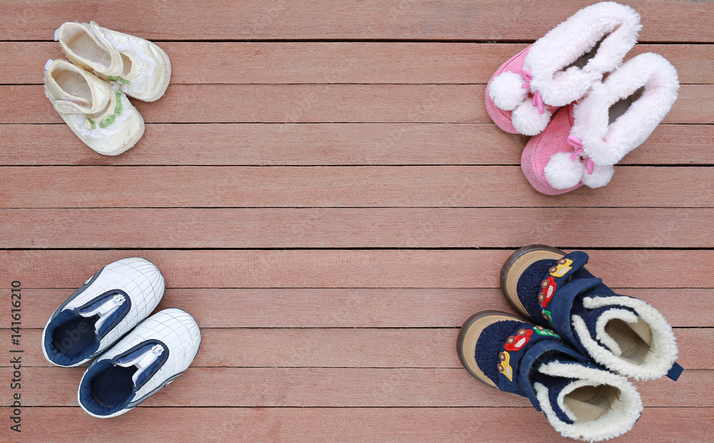 Cute baby shoes on wood plank, Little shoe on wood floor with copy space,  Top view Stock Photo | Adobe Stock