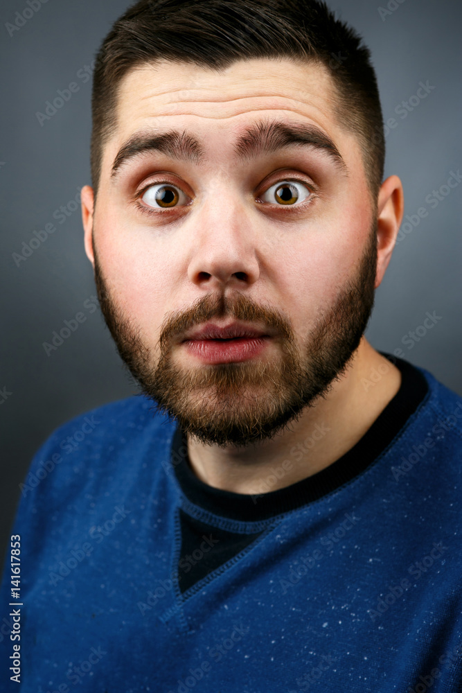 Funny bearded man with hazel eyes looks shoked Funny bearded man with hazel eyes looks shoked