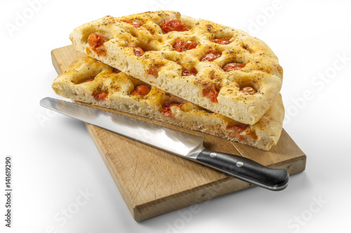 Apulian flat bread with tomatoes and knife