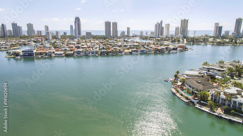 Aerial view looking towards Macintosh island with Cronin Island waterfront properties on the right, facing south with Surfers Paradise in the horizon.