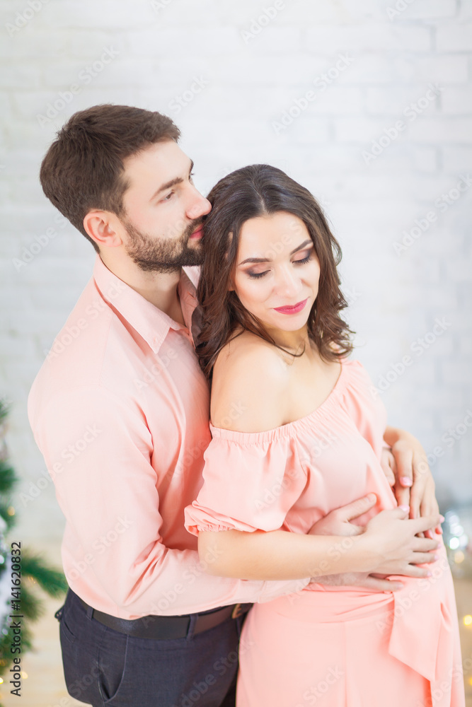young happy pregnant woman and her husband