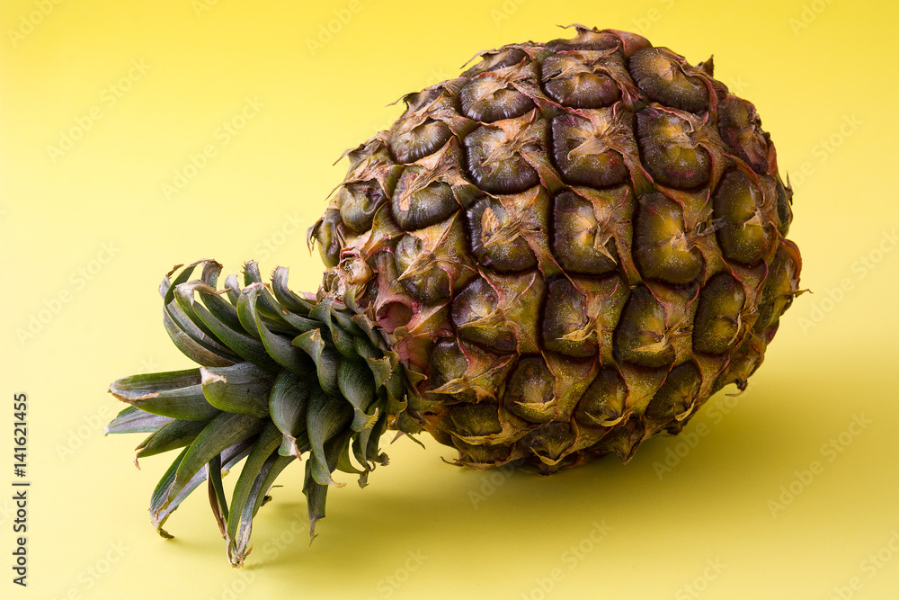 Pineapple isolated on yellow background. Copyspace.
Pineapple isolated on yellow background. Copyspace.