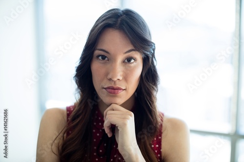 Thoughtful woman in office