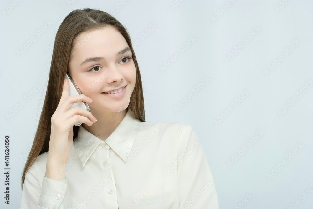 Businesswoman talking on mobile phone on white background Businesswoman talking on mobile phone on white background