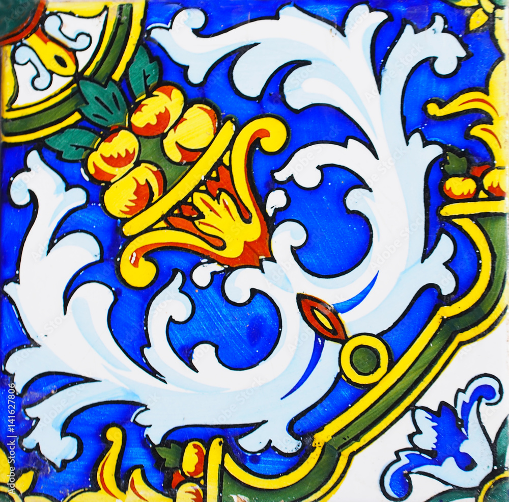 Detail of the traditional tiles from facade of old house. Spain. Valencia. Floral ornament. Majolica,