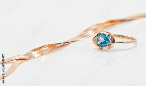 Elegant ring made of gold with large Topaz and gold chain