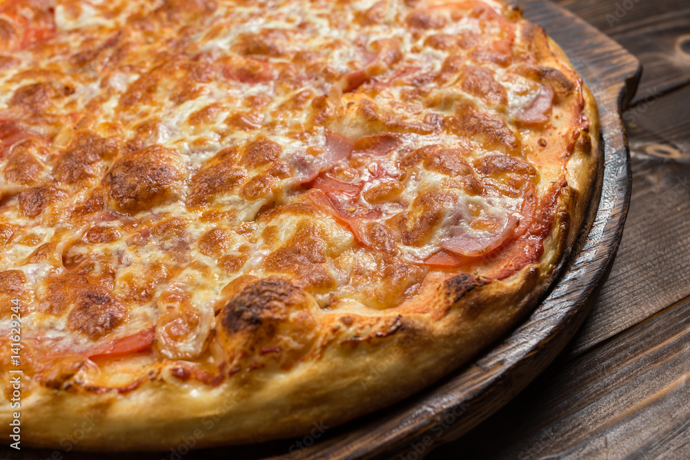 Pizza with Ham and Salami. Garnished with Olives Pizza with Ham and Salami. Garnished with Olives