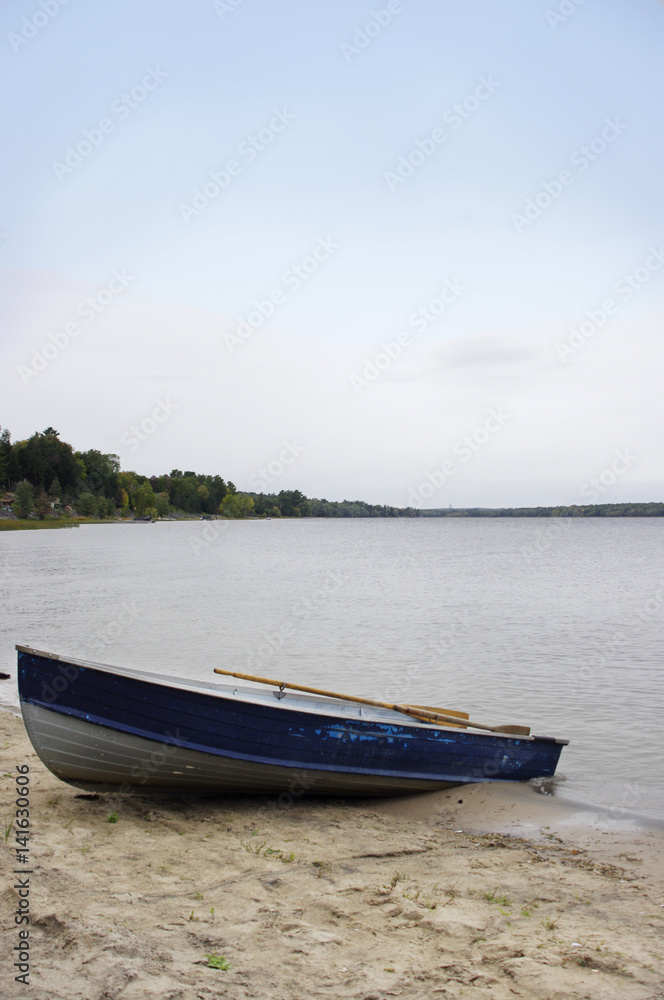 rustic blue boat on beach at river rustic blue boat on beach at river
