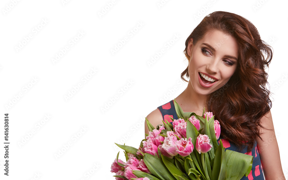 Beauty delicate woman smelling spring flowers Beauty delicate woman smelling spring flowers