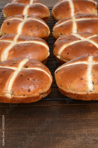 rows of hot cross buns cooling