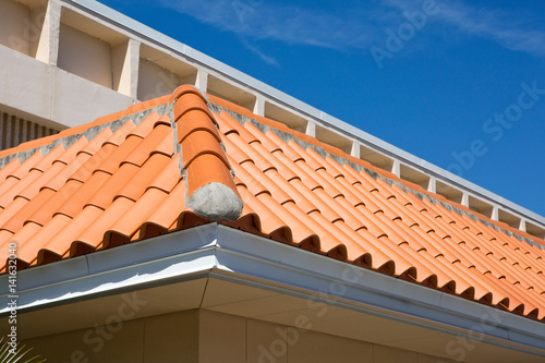 Detail of an overlapped barrel tile roof with cement mortared joints.