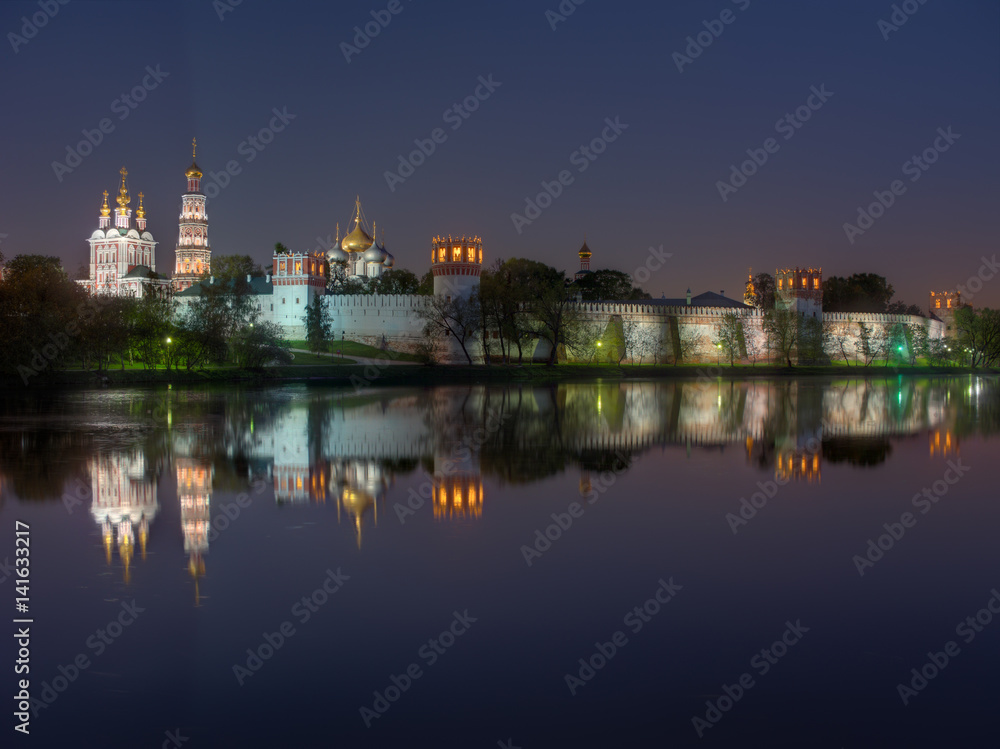 Moscow monastery Novodevichy Convent at night, with reflection in the pond