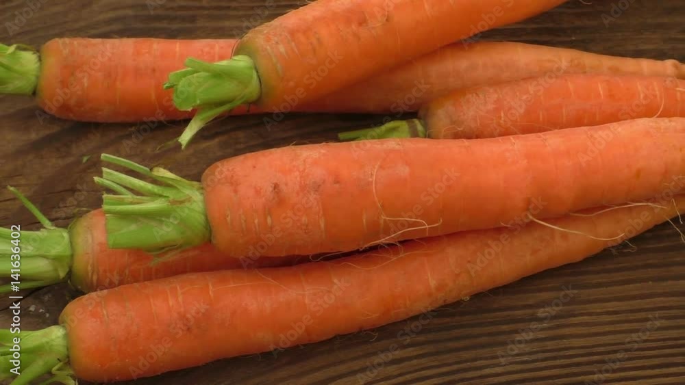 Fresh organic carrots with green tops
Fresh organic carrots with green tops