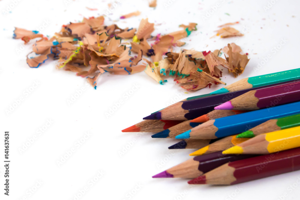 Colored pencils on a white background. Shavings on the back. Colored pencils on a white background. Shavings on the back.