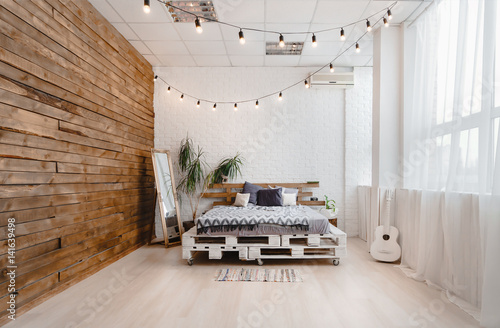 Light interior with bed and windows